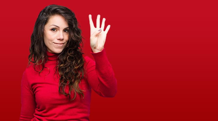 Woman holding up four fingers with red background